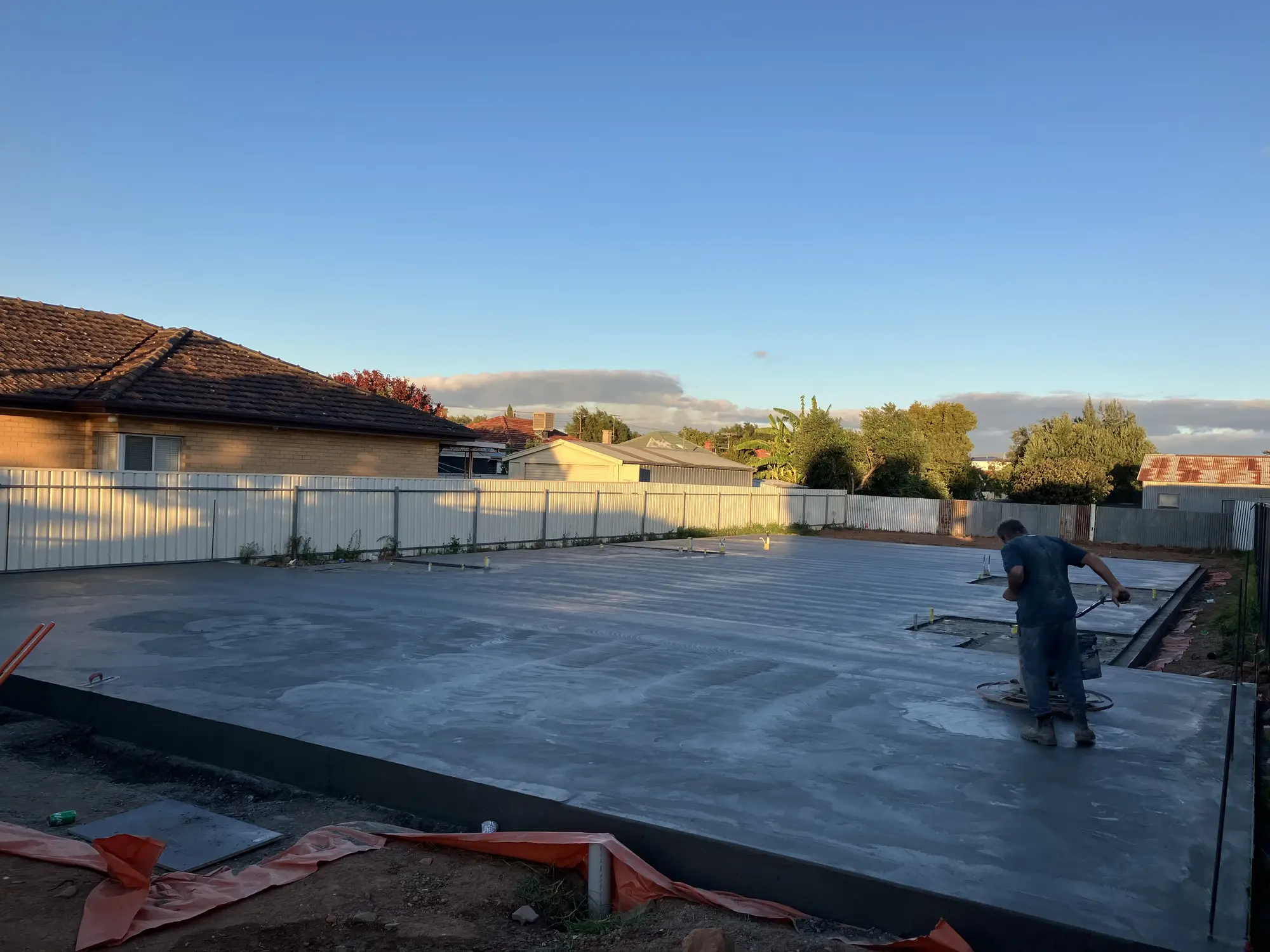 Concrete slab out in the open in a plot of land.