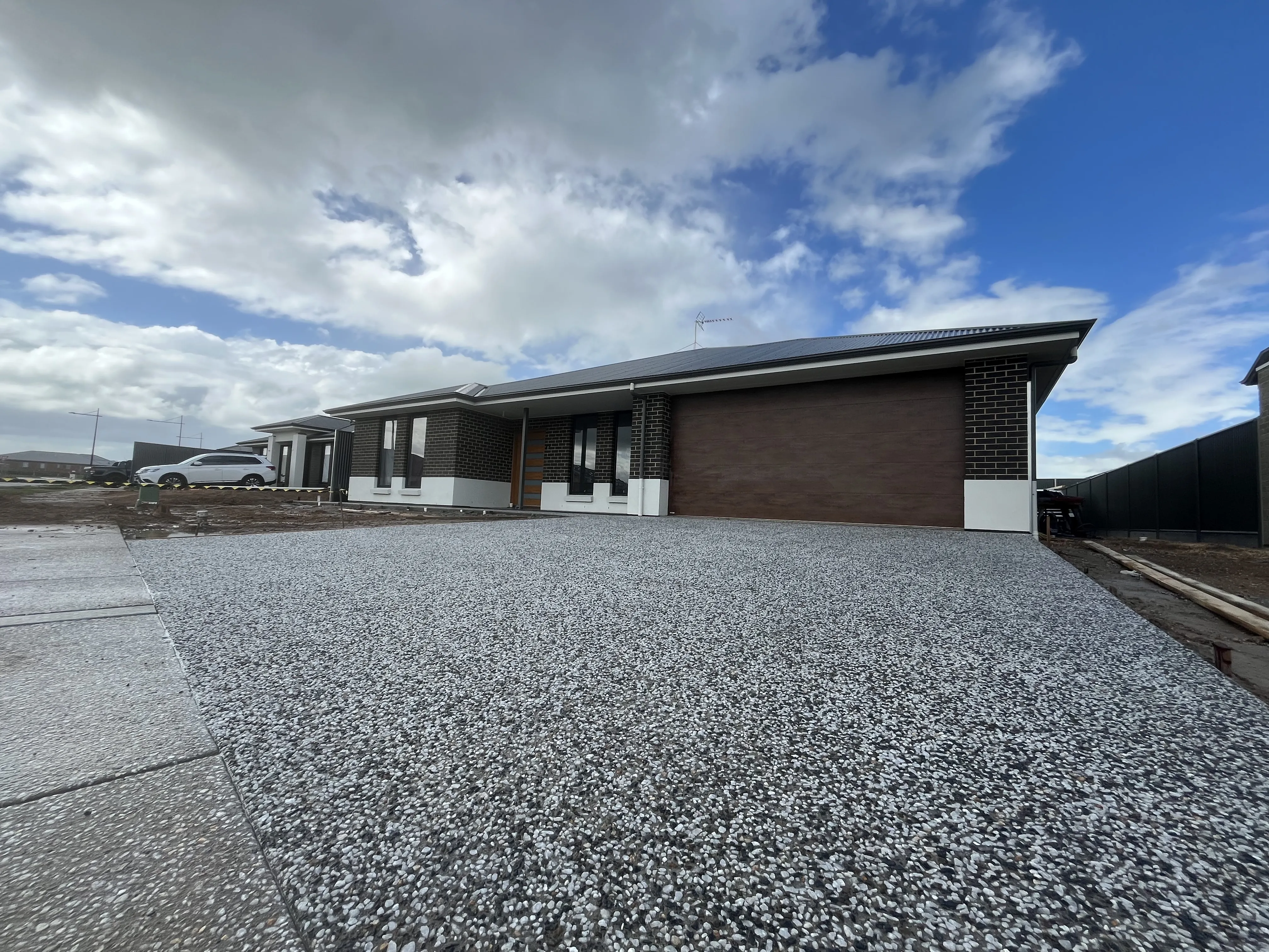 Exposed aggregate concrete driveway